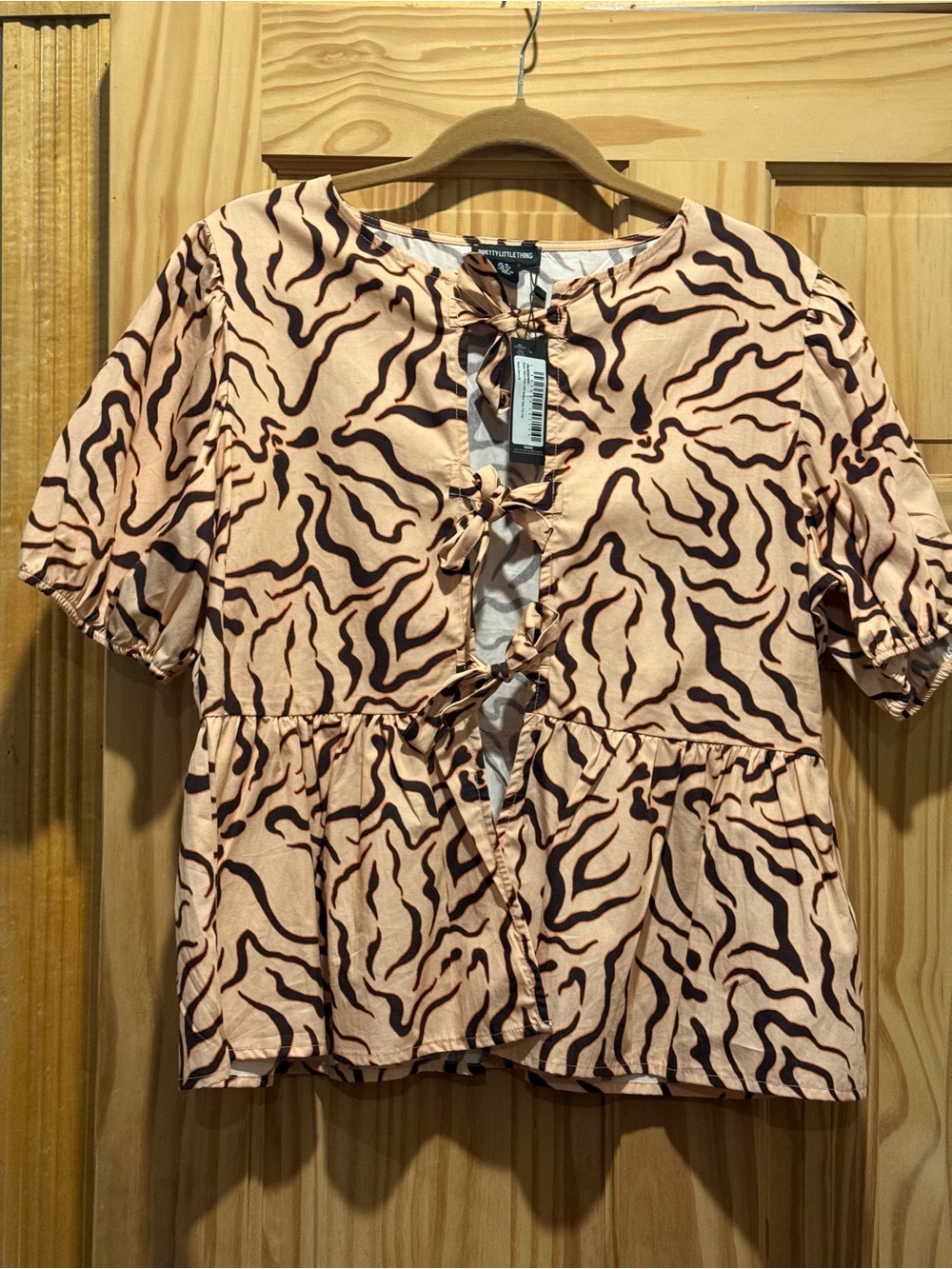 PrettyLittleThing Peach and Brown Zebra-Print Tie-Front Peplum Top